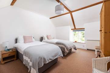 The spacious twin bedded room.