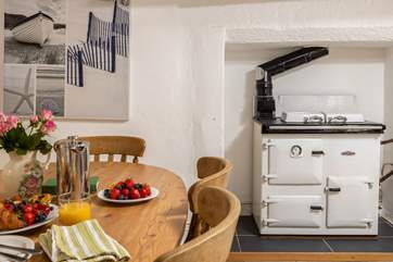 The oil-fired Rayburn adds warmth to this lovely cottage.