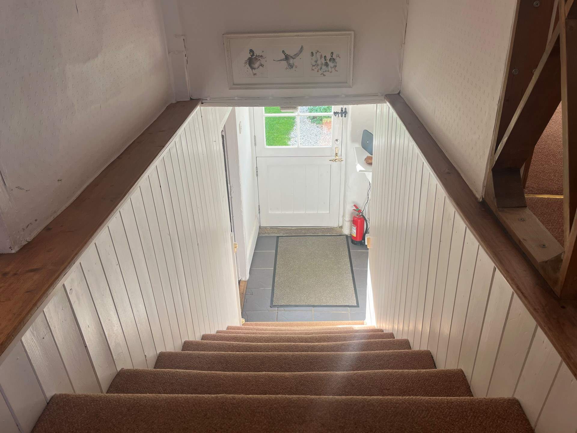 Please mind your head when going up and down the stairs in this charming cottage. 
