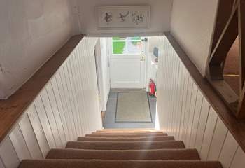 Please mind your head when going up and down the stairs in this charming cottage. 