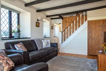 The cottage stairs lead up from the sitting-room to the pretty bedrooms and family shower-room