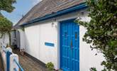 Enter the property through a pair of delightful blue doors. - Thumbnail Image