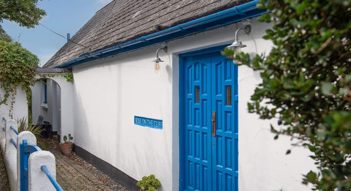 Enter the property through a pair of delightful blue doors.