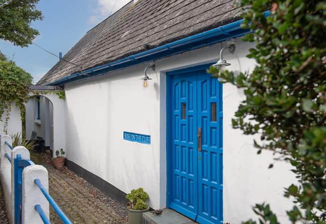 Enter the property through a pair of delightful blue doors.