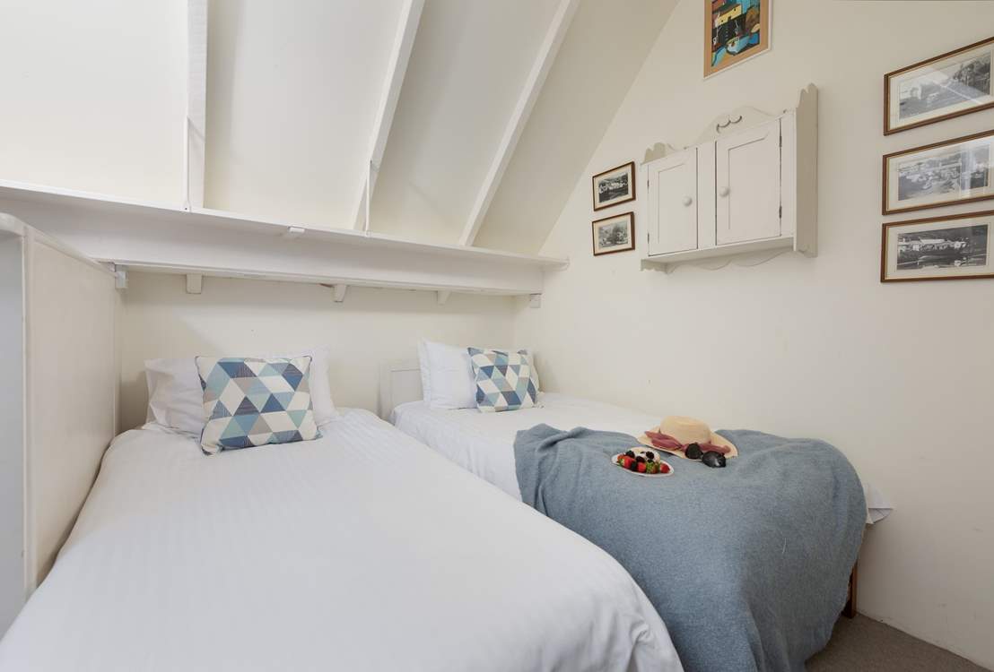 Bedroom 3 is connected to bedroom 1 by a small staircase up to the first floor.