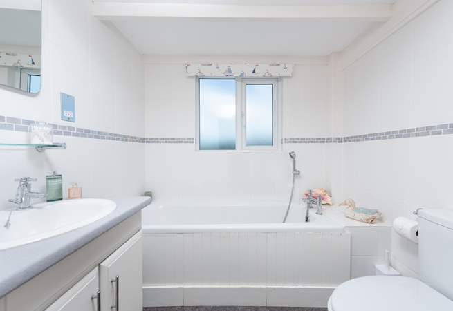 A fantastic family bathroom is located next to bedroom one.