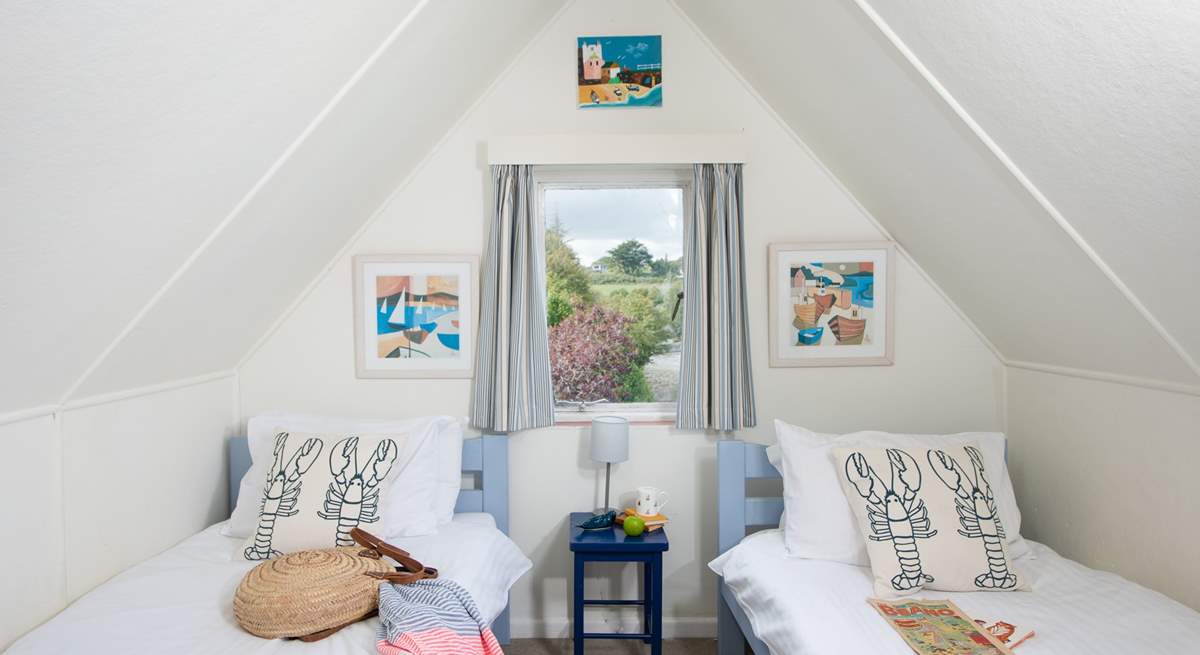 There are three delightful single beds in this room, ideal for little ones.