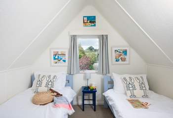 There are three delightful single beds in this room, ideal for little ones.