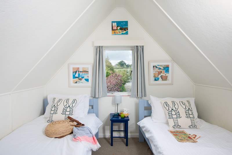 There are three delightful single beds in this room, ideal for little ones.