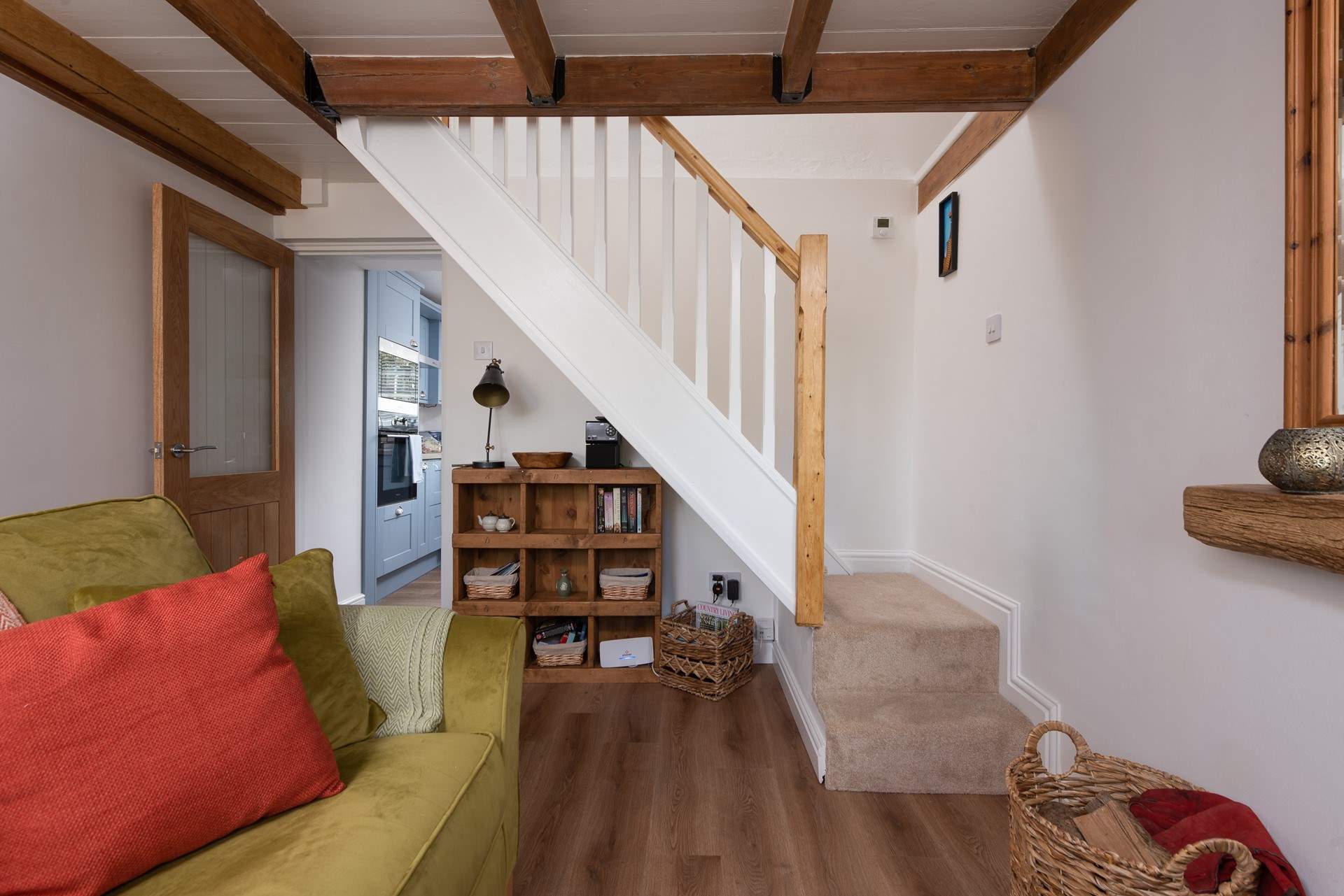 Steep cottage stairs lead upstairs to the bedroom. 