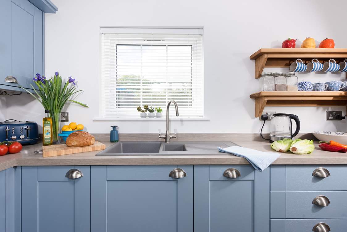 The lovely kitchen has everything you might need.