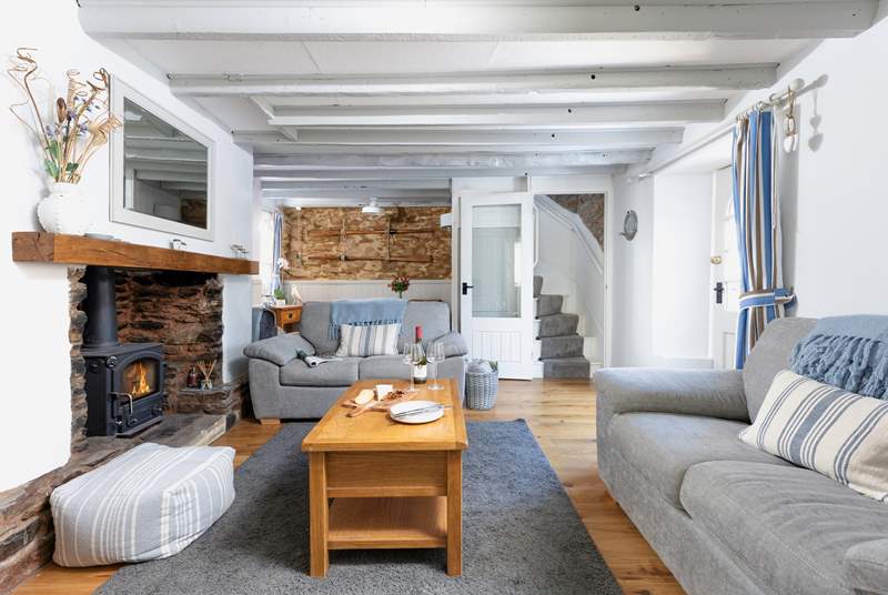The cosy sitting-room with dining-area has a wood-burner to keep you cosy throughout the year.