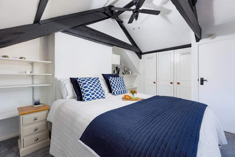The characterful bedroom on the second floor has a lovely king-size bed.