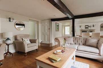 The open plan sitting/dining-room is perfect for socialising in.