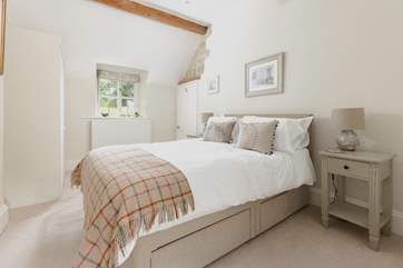 Sink back in to the super comfy bed in the main bedroom.