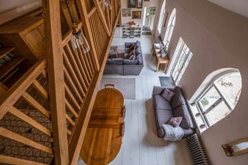 Looking from the first floor galleried landing to the downstairs living space.