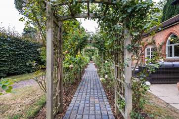 Smell the wonderful scent of roses as you wander through the arches.