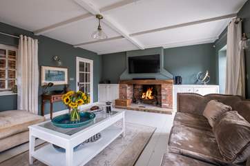 The real fire will keep you warm in cooler months.