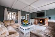 The gorgeous snug has comfy sofas and a fabulous feature fire place.