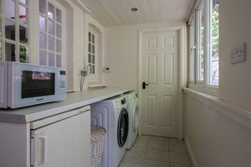 The handy utility-room has a washing machine and tumble-drier.