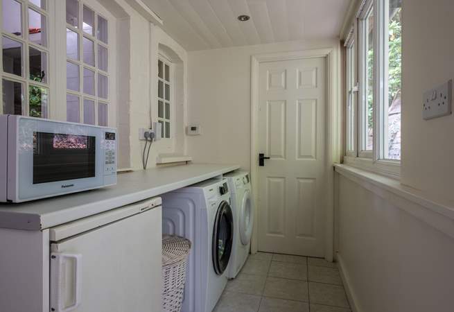 The handy utility-room has a washing machine and tumble-drier.