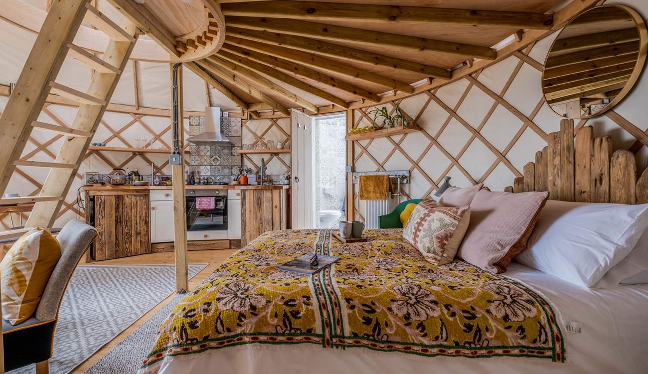 To the left of the bed is the shower-room. 