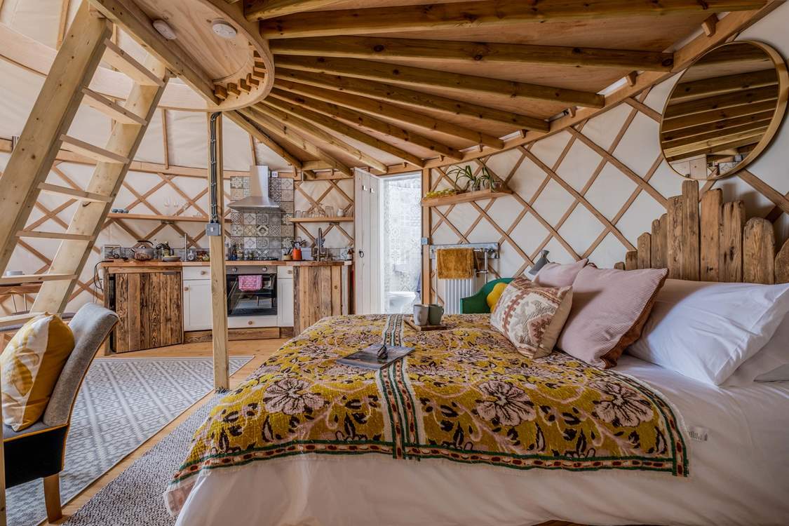 To the left of the bed is the shower-room.