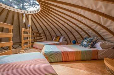 With three small single beds, younger family members will love this space!