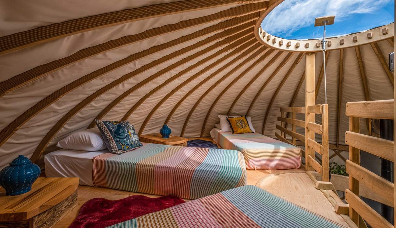 With three small single beds, younger family members will love this space and the traditional Toono window. 
