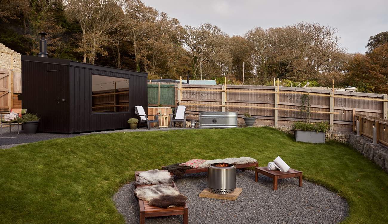 Relax and revive with the wood-fired sauna and cold plunge pool, before lounging by the firepit...