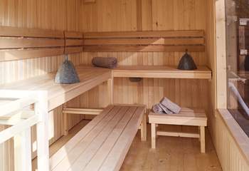 Savour the heat of the traditional wood-fired sauna. 