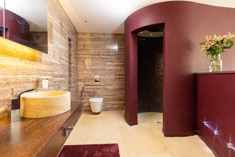The gorgeous bathroom area is home to a wonderfully unique shower.