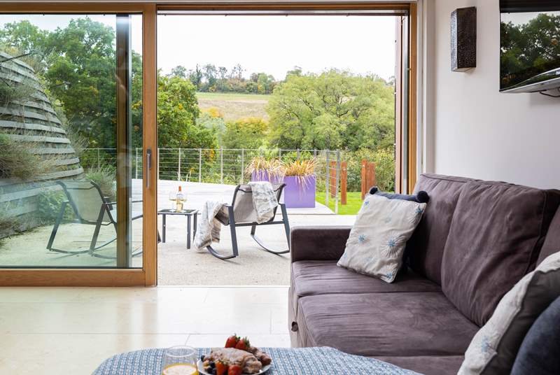 Open up the fabulous floor-to-ceiling sliding door and let in the fresh Cotswold breeze.