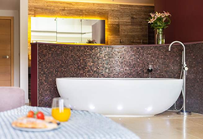 Settle down and enjoy a soak in the indulgent roll-top bath before retreating to bed.