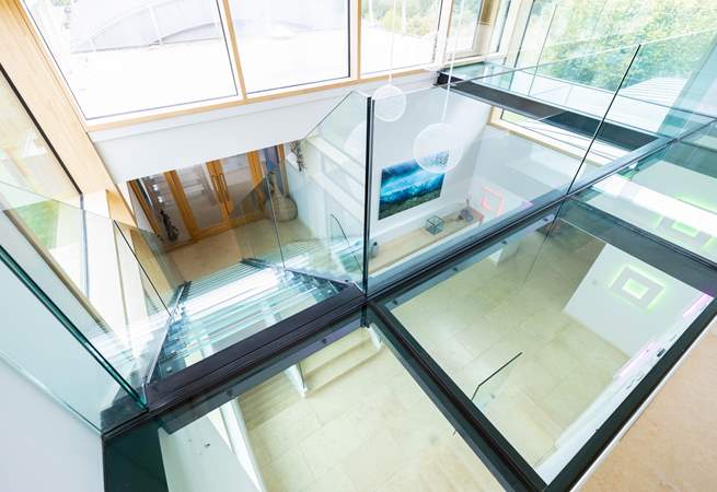 A fabulous glass open tread staircase provides access to the large office space.