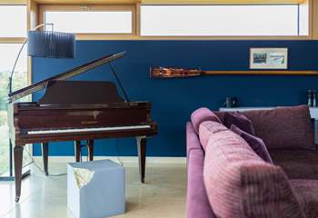 A gorgeous mini grand piano provides an excellent source of entertainment in the evenings. 