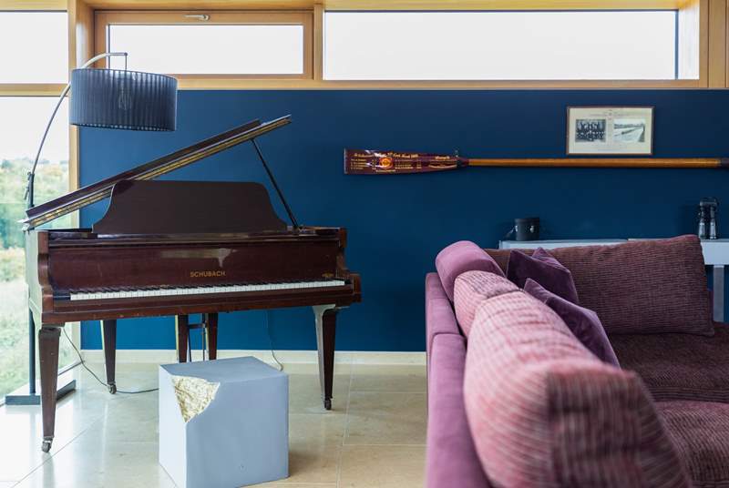 A gorgeous mini grand piano provides an excellent source of entertainment in the evenings. 