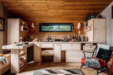 The kitchen is perfectly equipped for cooking a romantic meal for two.