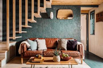 Sink into the snug sofa and simply unwind with one of the many books provided by the owners.