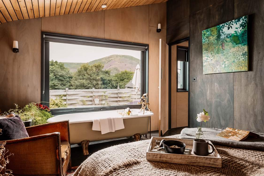 To the right of the open plan living space, you'll find the dreamy main bedroom.