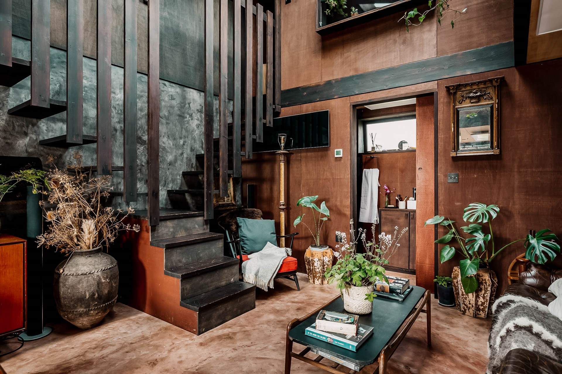 Climb the stairs on the left to the main bedroom, or on the right to the incredible bathtub. 