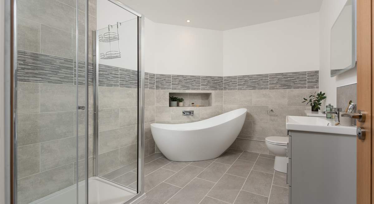 The family bathroom has a gorgeous free-standing bath for a long soak after a busy day and a separate shower.