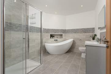 The family bathroom has a gorgeous free-standing bath for a long soak after a busy day and a separate shower.