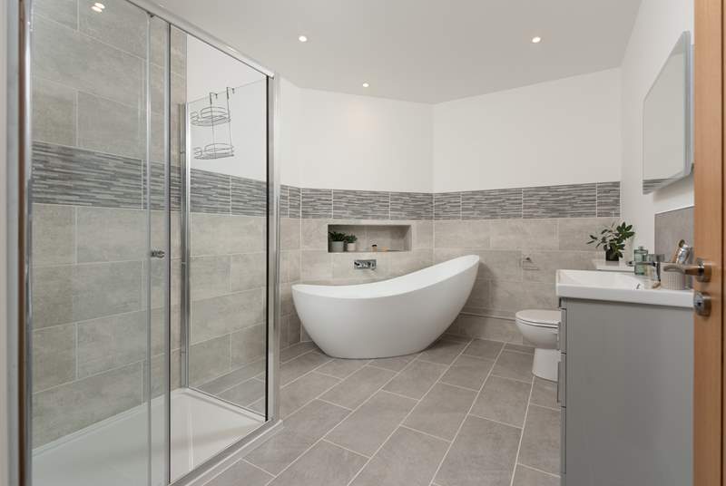 The family bathroom has a gorgeous free-standing bath for a long soak after a busy day and a separate shower.