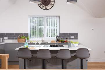 Perch on a stool and chat whilst the chef creates a culinary delight.