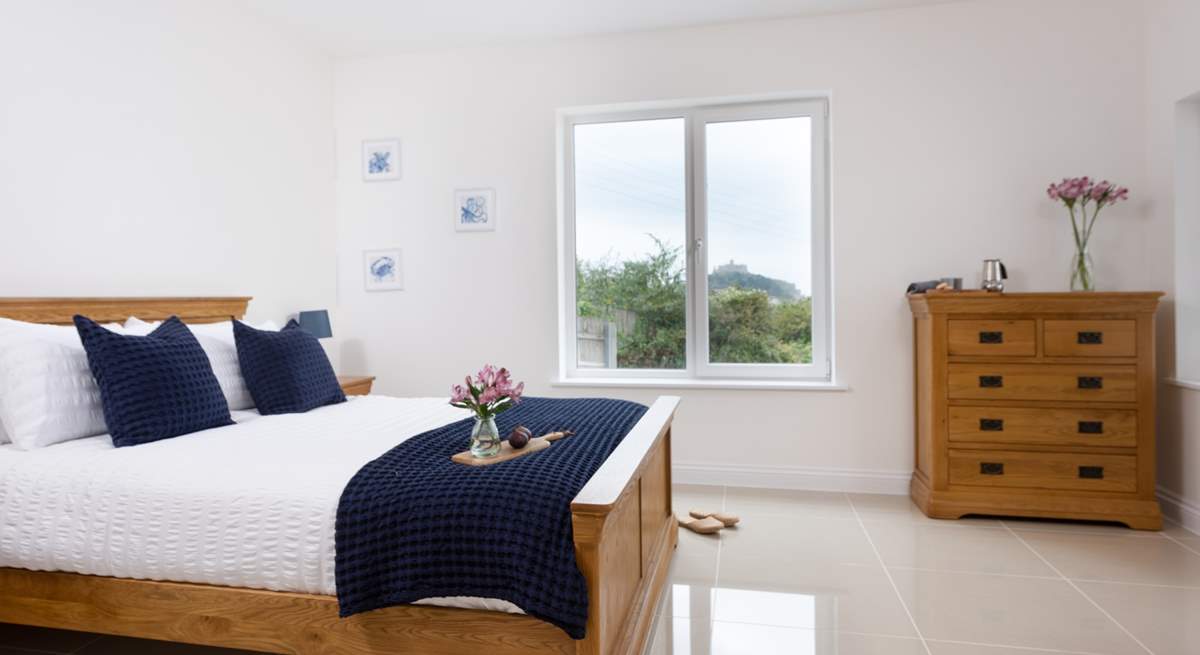 The main bedroom has a comfy king-size bed and a view of St Michael's Mount.