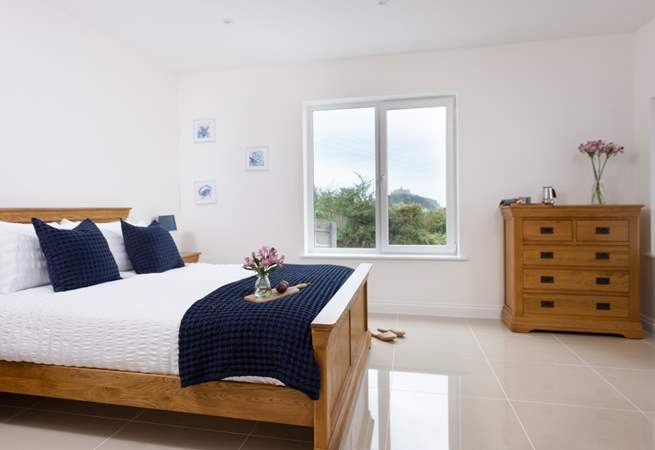 The main bedroom has a comfy king-size bed and a view of St Michael's Mount.