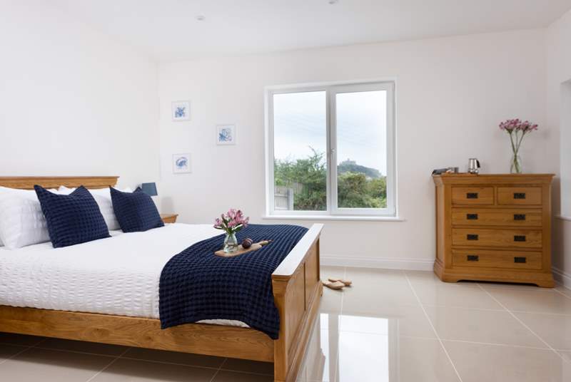 The main bedroom has a comfy king-size bed and a view of St Michael's Mount.