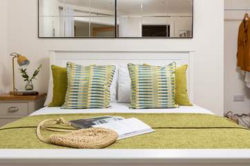 Unwind on the inviting king-size bed after a big day out.