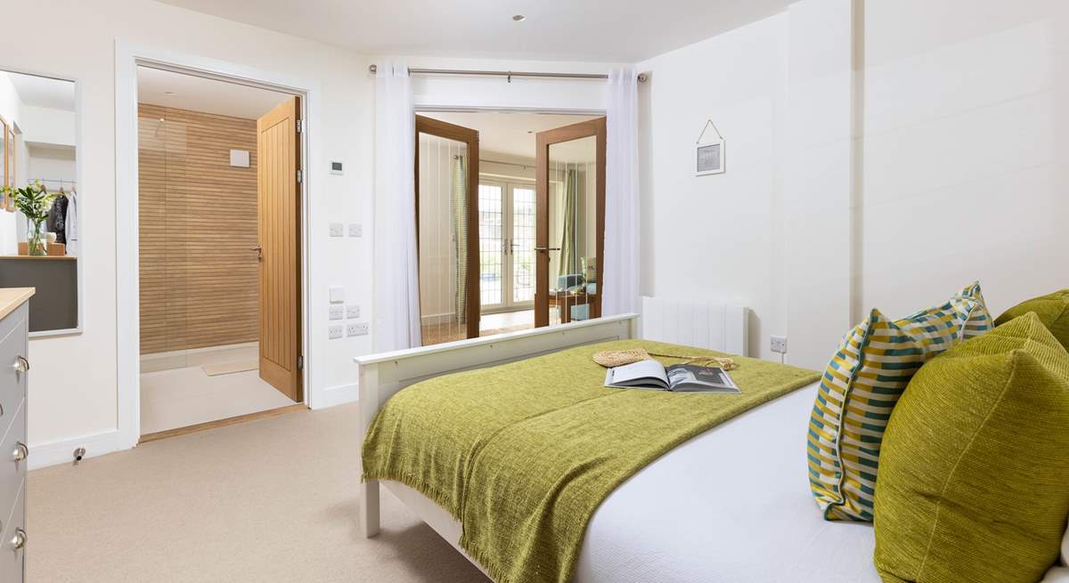 Wander through the double doors to discover the fantastic bedroom.